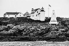 Tenants Harbor Lightouse Over Rocky Shore in Maine - BW